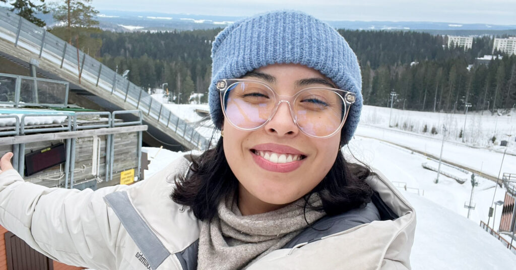 Priscilla is smiling on the top of the Puijo hill.
